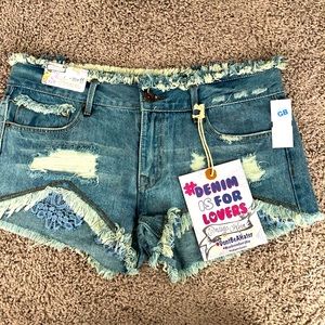 Distressed denim shorts